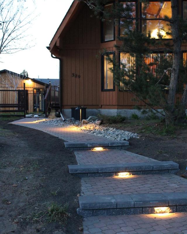 Professional landscape lighting installation in Strathmore - pathway lights, tree uplighting, and garden illumination for safety and beauty