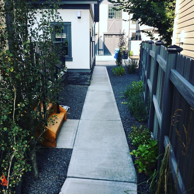 Custom patio and retaining wall construction in Strathmore - natural stone and precast brick installations for residential landscaping and outdoor living spaces