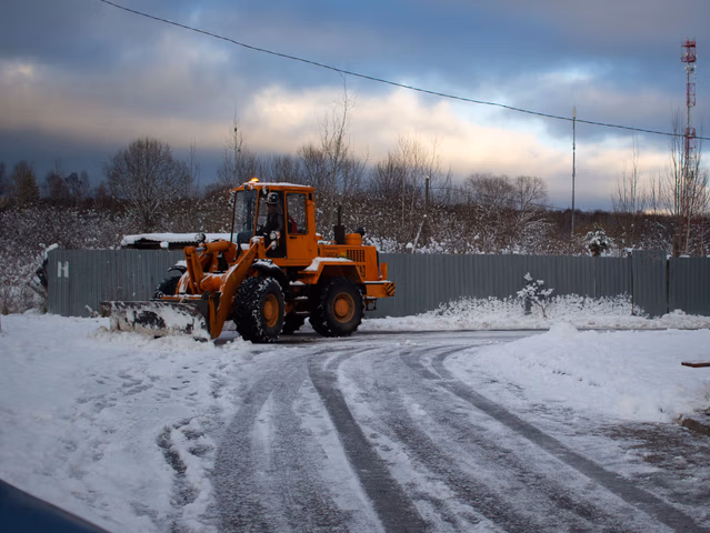 Professional snow removal services in Strathmore and Chestermere - commercial and residential snow clearing, de-icing, and winter property maintenance